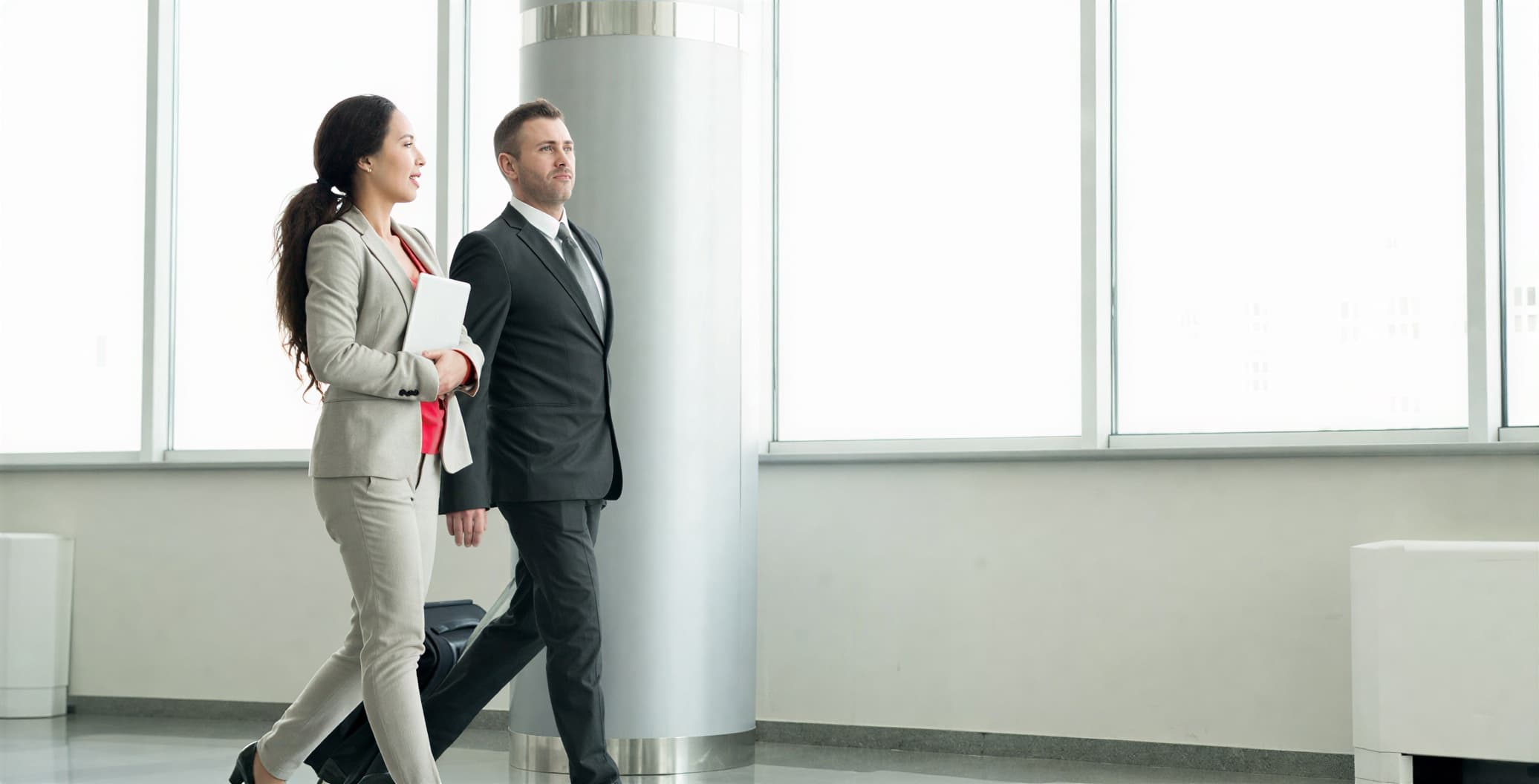 Property managers walking through a building lobby