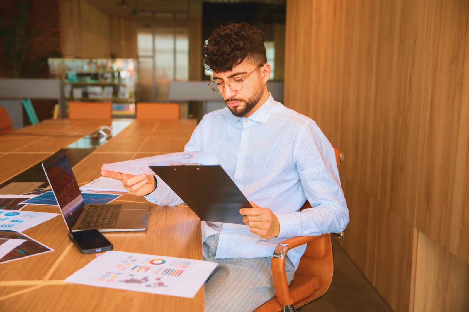 A property manager reviewing reports at a desk