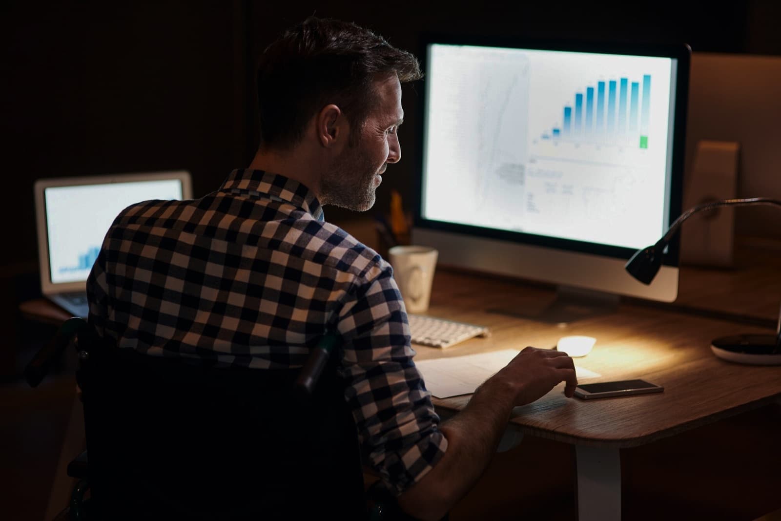 A partner reviewing a deal dashboard on a computer