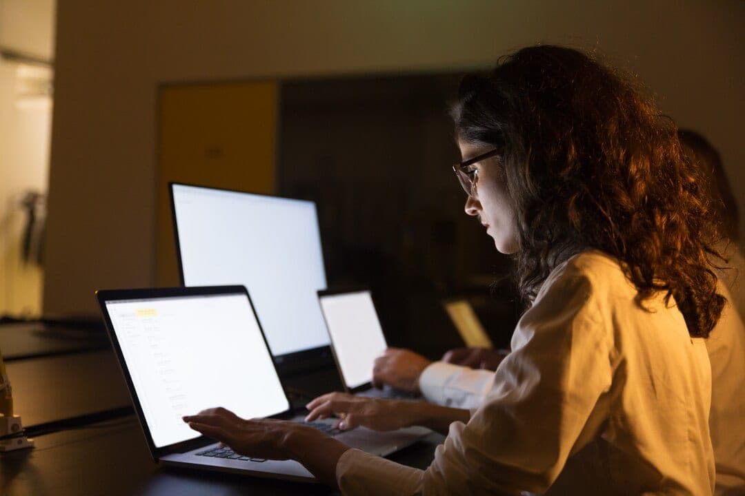 A partner working through property updates on a laptop